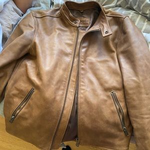 Tan leather roots coat in new perfect condition